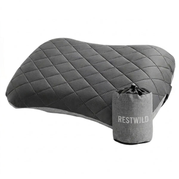 Ultralight Camping Pillow in dark gray quilted fabric, inflated, next to its gray Restwild stuff sack