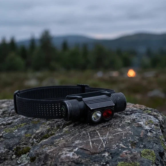 Restwild Backcountry Duo headlamp on a rock at dusk