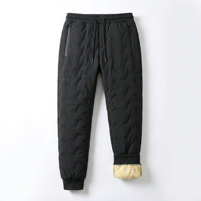 Black fleece-lined winter pants laid flat, one cuff turned up to show the cream sherpa fleece lining